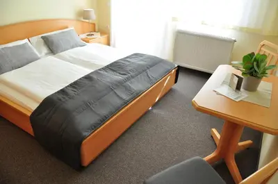 Ein Bett oder Betten in einem Zimmer der Unterkunft Gästehaus Hofer