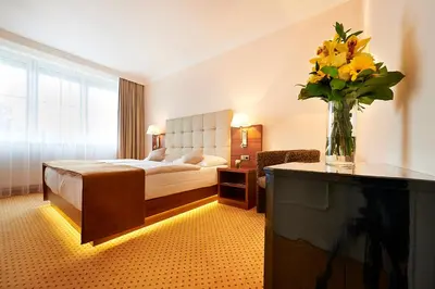Ein Bett oder Betten in einem Zimmer der Unterkunft Hotel Admiral am Kurpark