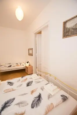 Ein Bett oder Betten in einem Zimmer der Unterkunft Apartments Opera