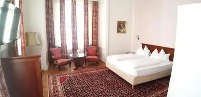 Ein Bett oder Betten in einem Zimmer der Unterkunft Hotel Domizil