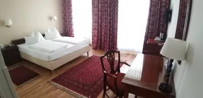 Ein Bett oder Betten in einem Zimmer der Unterkunft Hotel Domizil