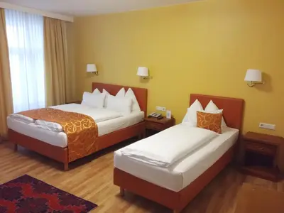 Ein Bett oder Betten in einem Zimmer der Unterkunft Hotel Domizil