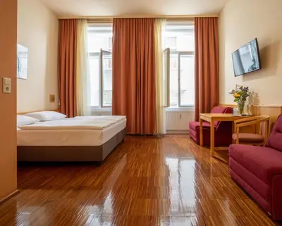 Ein Bett oder Betten in einem Zimmer der Unterkunft Hotel Post Wien
