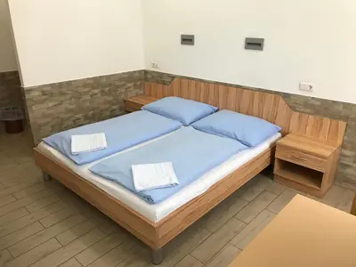 Ein Bett oder Betten in einem Zimmer der Unterkunft Hotel Pribitzer