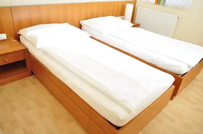 Ein Bett oder Betten in einem Zimmer der Unterkunft Lei's WOK