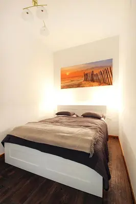 Ein Bett oder Betten in einem Zimmer der Unterkunft Lana Appartements
