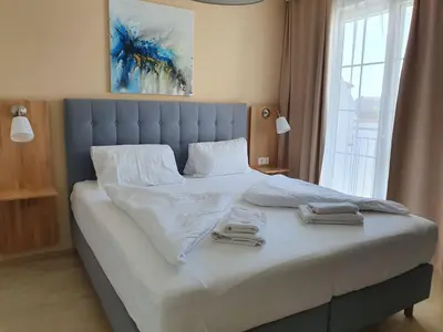 Ein Bett oder Betten in einem Zimmer der Unterkunft Pension Laubenhof