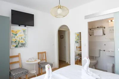 Ein Bett oder Betten in einem Zimmer der Unterkunft Pension Laubenhof