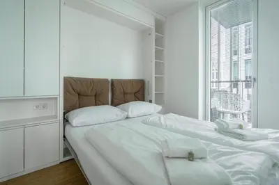Ein Bett oder Betten in einem Zimmer der Unterkunft easy-flat Grüner Prater - Balcony Apartments near Metro