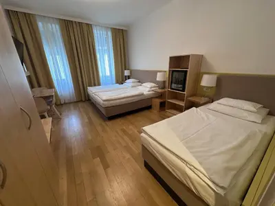 Ein Bett oder Betten in einem Zimmer der Unterkunft Hotel Caroline