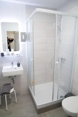 Ein Badezimmer in der Unterkunft Pension & Restaurant La Amalia