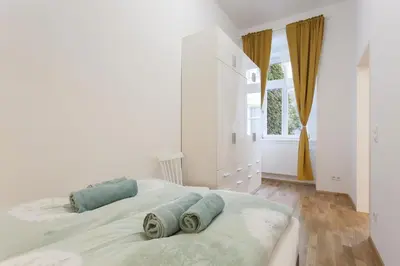 Ein Bett oder Betten in einem Zimmer der Unterkunft GAL Apartments Vienna