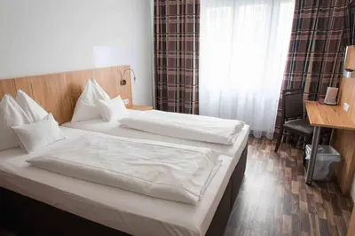 Ein Bett oder Betten in einem Zimmer der Unterkunft Pension Dr. Geissler