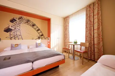 Ein Bett oder Betten in einem Zimmer der Unterkunft JUFA Hotel Wien City