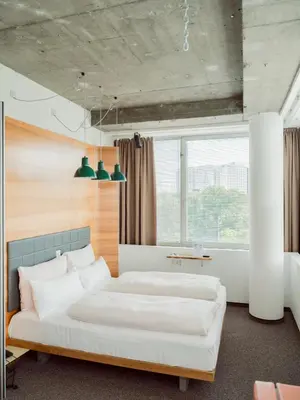 Ein Bett oder Betten in einem Zimmer der Unterkunft Hotel Daniel Vienna - Smart Lifestyle Near City Centre