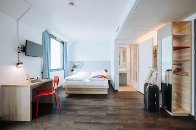 Ein Bett oder Betten in einem Zimmer der Unterkunft MEININGER Hotel Wien Downtown Franz