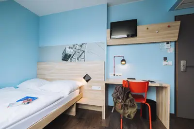 Ein Bett oder Betten in einem Zimmer der Unterkunft MEININGER Hotel Wien Downtown Franz