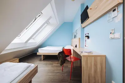 Ein Bett oder Betten in einem Zimmer der Unterkunft MEININGER Hotel Wien Downtown Franz