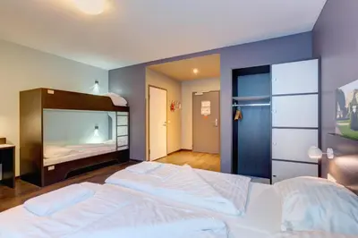 Ein Bett oder Betten in einem Zimmer der Unterkunft MEININGER Hotel Wien Downtown Sissi