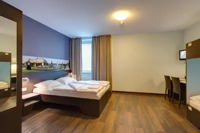 Ein Bett oder Betten in einem Zimmer der Unterkunft MEININGER Hotel Wien Downtown Sissi