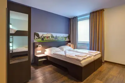 Ein Bett oder Betten in einem Zimmer der Unterkunft MEININGER Hotel Wien Downtown Sissi