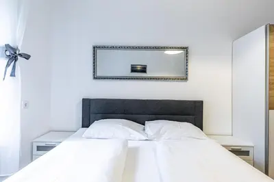 Ein Bett oder Betten in einem Zimmer der Unterkunft CHRISTIANO Apartments - Villa Schönbrunn