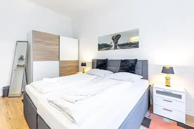 Ein Bett oder Betten in einem Zimmer der Unterkunft CHRISTIANO Apartments - Villa Schönbrunn