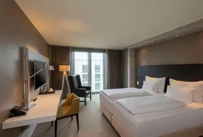 Ein Bett oder Betten in einem Zimmer der Unterkunft Doubletree by Hilton Vienna Schonbrunn