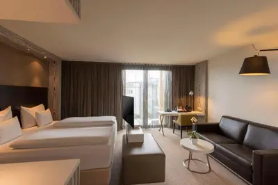 Ein Bett oder Betten in einem Zimmer der Unterkunft Doubletree by Hilton Vienna Schonbrunn