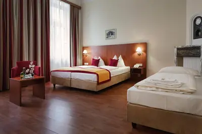 Ein Bett oder Betten in einem Zimmer der Unterkunft Hotel Mozart