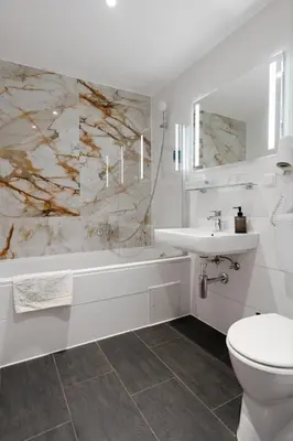 Ein Badezimmer in der Unterkunft Hotel Mozart
