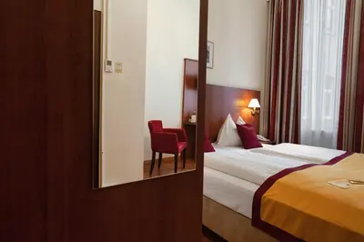 Ein Bett oder Betten in einem Zimmer der Unterkunft Hotel Mozart