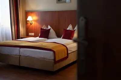 Ein Bett oder Betten in einem Zimmer der Unterkunft Hotel Mozart