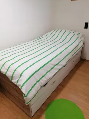 Ein Bett oder Betten in einem Zimmer der Unterkunft D&E Rooms