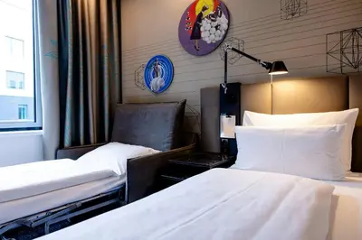 Ein Bett oder Betten in einem Zimmer der Unterkunft Motel One Wien Westbahnhof