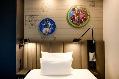 Ein Bett oder Betten in einem Zimmer der Unterkunft Motel One Wien Westbahnhof