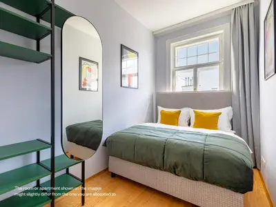 Ein Bett oder Betten in einem Zimmer der Unterkunft Numa Vienna Strauss