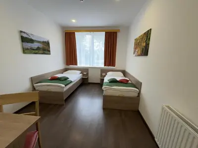 Ein Bett oder Betten in einem Zimmer der Unterkunft WinBudget 
