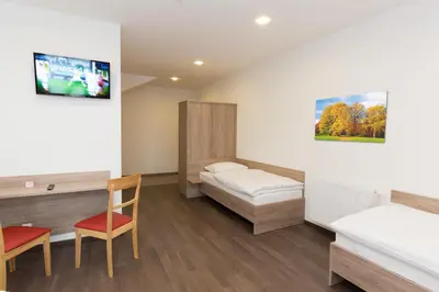 Ein Bett oder Betten in einem Zimmer der Unterkunft WinBudget 