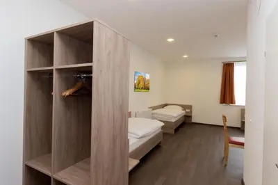 Ein Bett oder Betten in einem Zimmer der Unterkunft WinBudget 