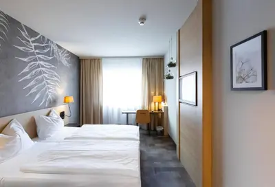 Ein Bett oder Betten in einem Zimmer der Unterkunft Hotel Das Himberg