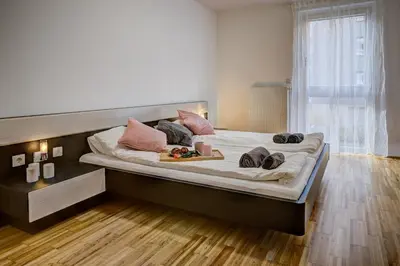 Ein Bett oder Betten in einem Zimmer der Unterkunft Carin Deluxe II