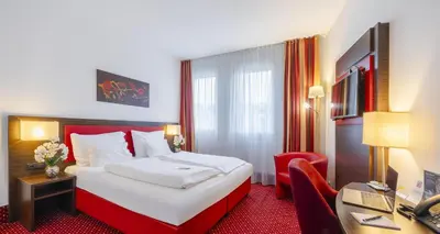 Ein Bett oder Betten in einem Zimmer der Unterkunft PLAZA INN Amedia Wien