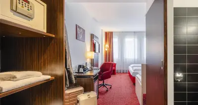 Ein Bett oder Betten in einem Zimmer der Unterkunft PLAZA INN Amedia Wien