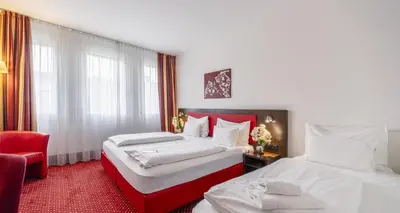 Ein Bett oder Betten in einem Zimmer der Unterkunft PLAZA INN Amedia Wien