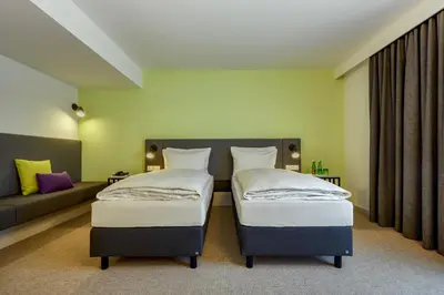 Ein Bett oder Betten in einem Zimmer der Unterkunft H+ Hotel Wien