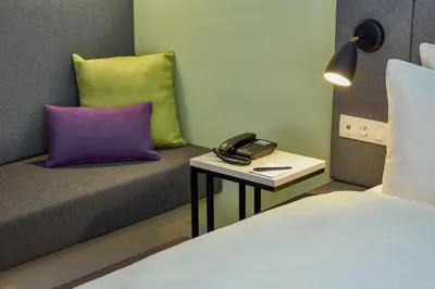 Ein Bett oder Betten in einem Zimmer der Unterkunft H+ Hotel Wien