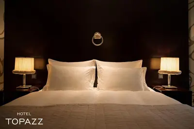 Ein Bett oder Betten in einem Zimmer der Unterkunft Hotel Topazz & Lamée