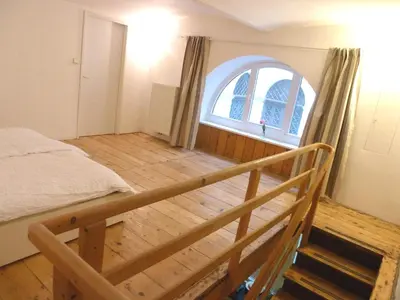Ein Bett oder Betten in einem Zimmer der Unterkunft Sobieski Maisonette Apartments