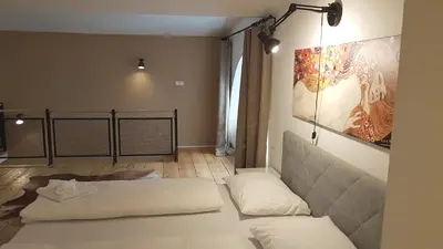 Ein Bett oder Betten in einem Zimmer der Unterkunft Sobieski Maisonette Apartments